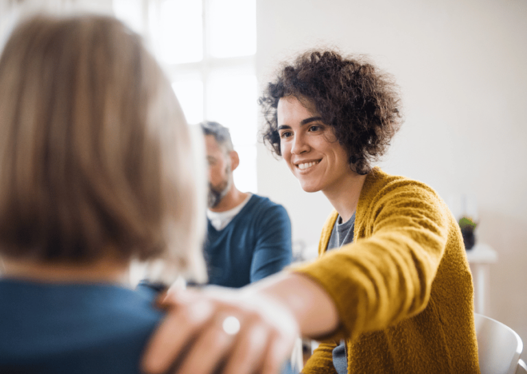 female employee reassuring another colleague