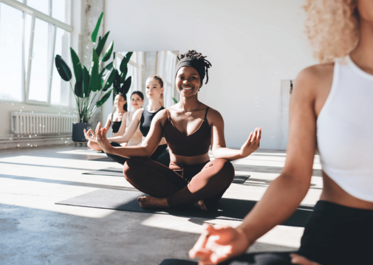 diverse female yoga group