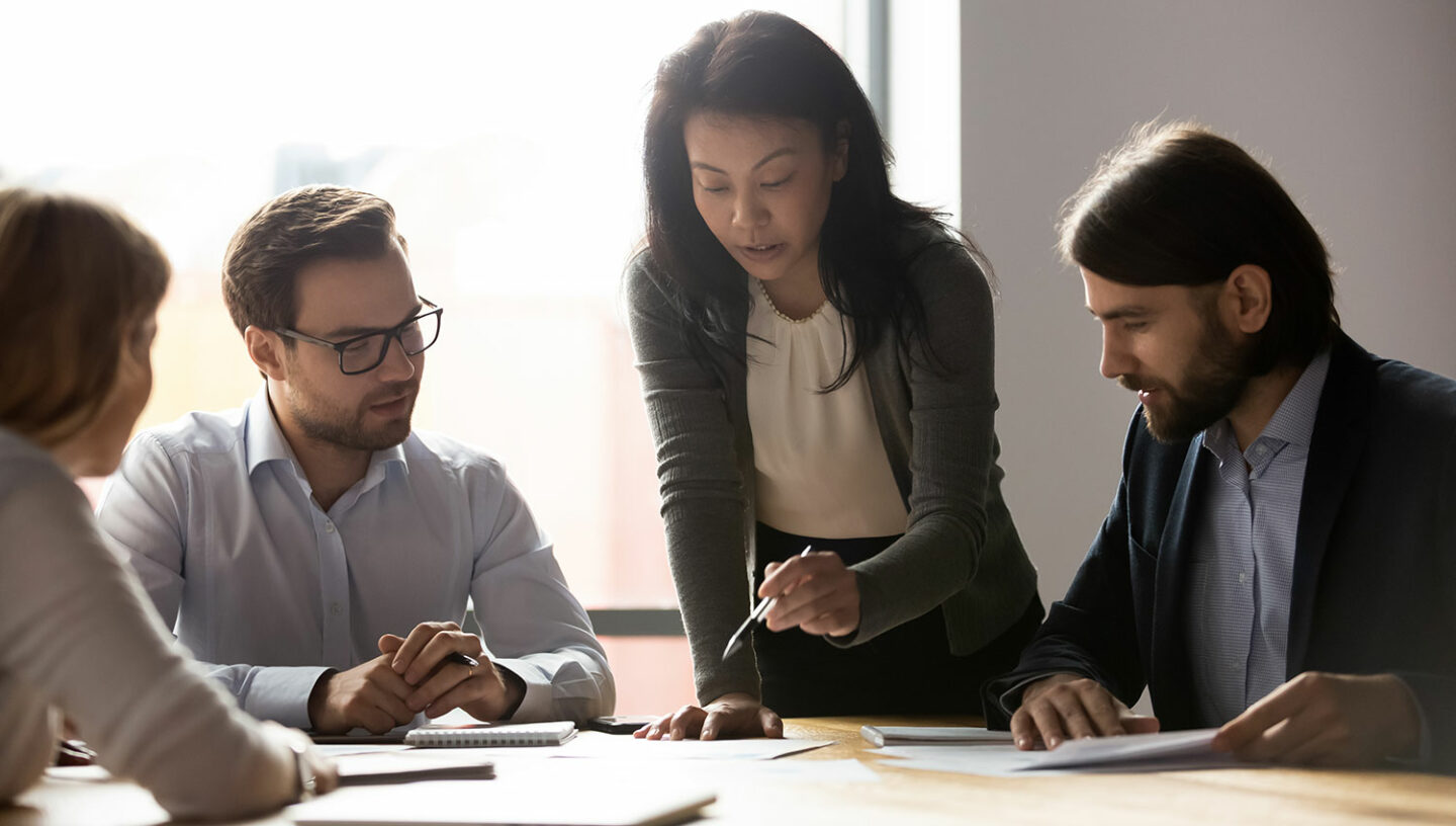 Female leading a business meeting