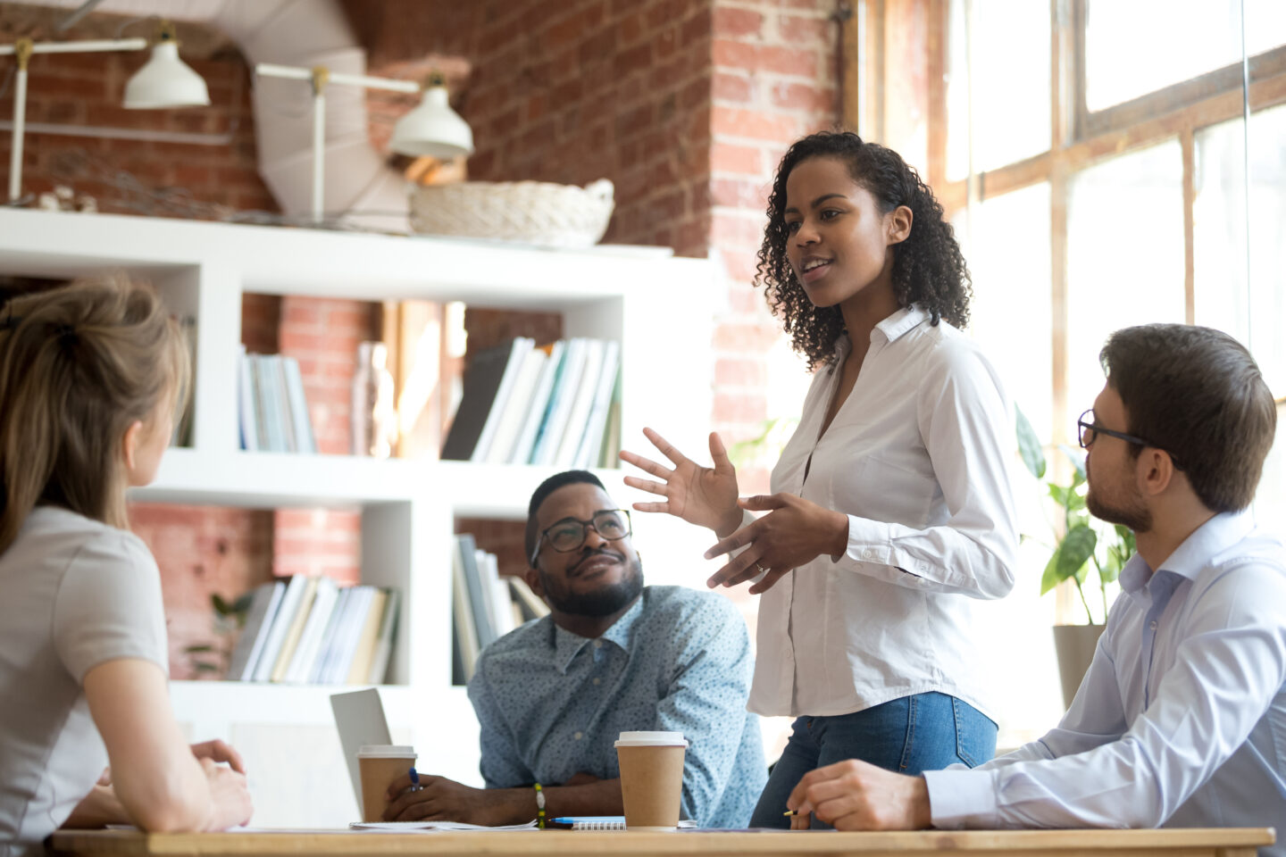 Woman talking in a team meeting in a psychological safe environment