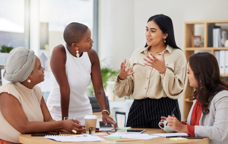 Diverse group, teamwork and young business women brainstorming, collaboration or cooperation. Ambitious confident professional team of colleagues talking and planning a strategy together.