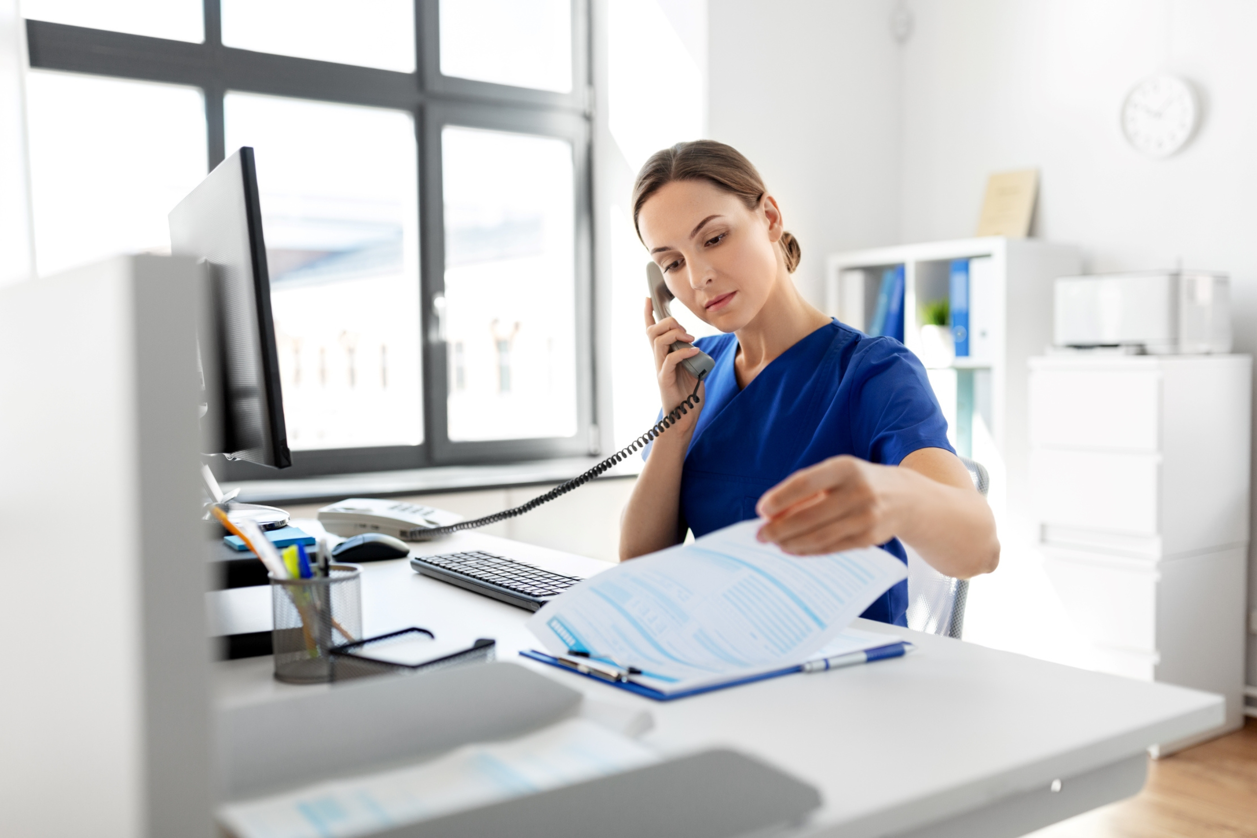 doctor smiling on phone