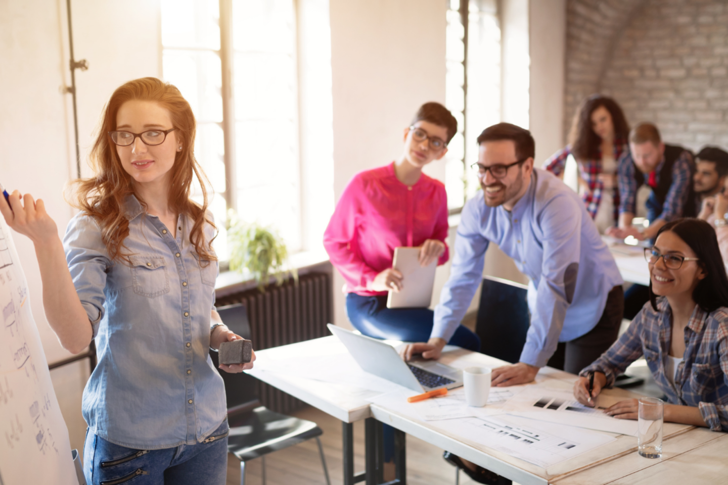 Happy employees contributing to office discussion