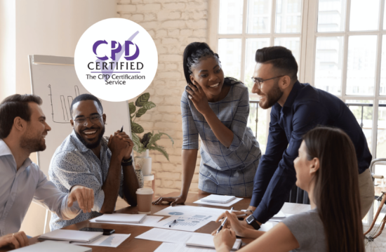 diverse group of employees gathered around a meeting table smiling