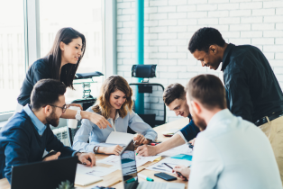 Group of colleagues during a productive staff meeting