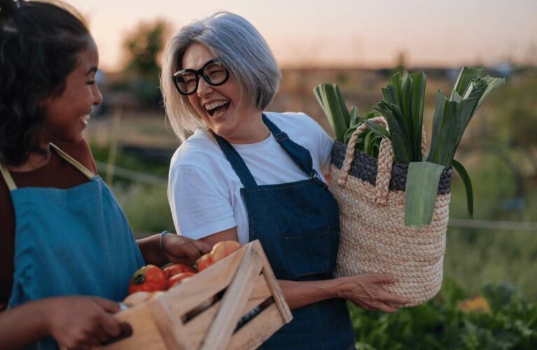Image shows older women carrying fresh produce